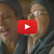 A Jewish woman and Muslim woman sing together. (ScreensAhot)