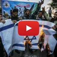 Palestinians burn an Israeli flag
