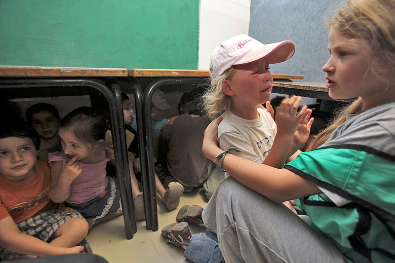 Children flee rockets