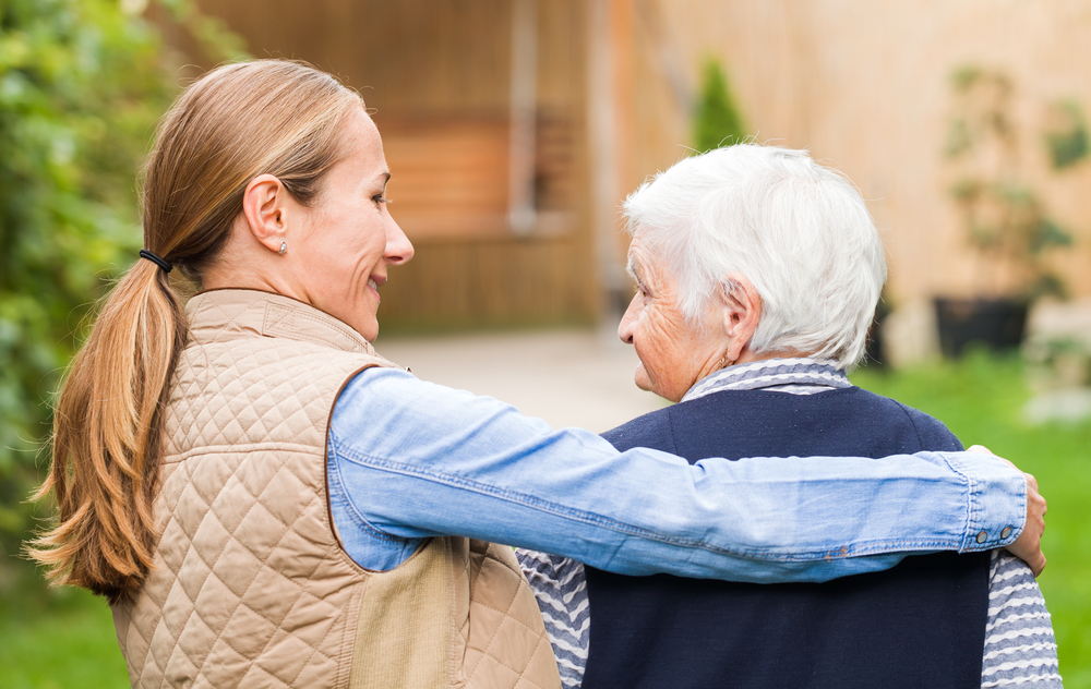 elderly person with caregiver