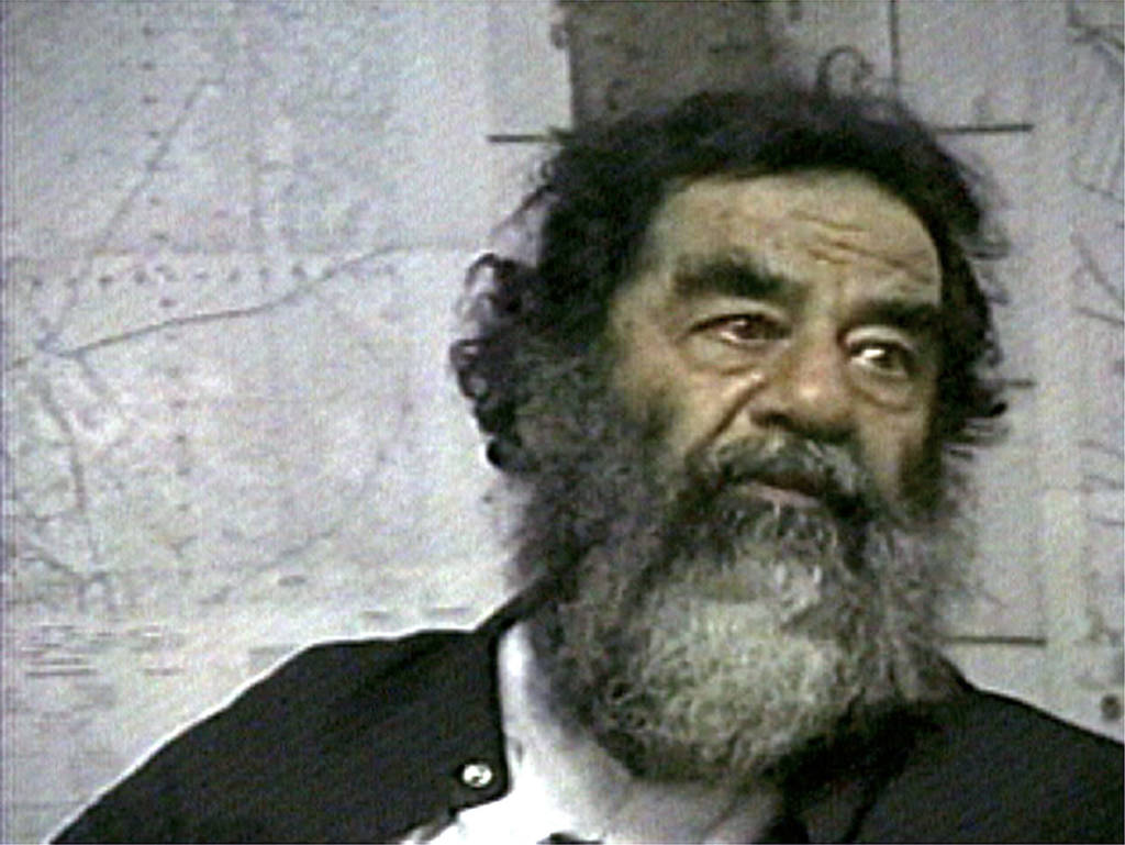 Saddam Hussein soon after his capture near Tiktit, Iraq. (AP Photo/US Military via APTN)