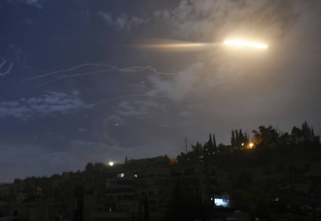 Israeli missiles striking an Iranian target in Syria. (SANA via AP)