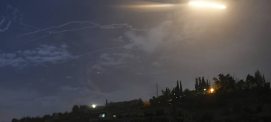 Israeli missiles striking an Iranian target in Syria. (SANA via AP)