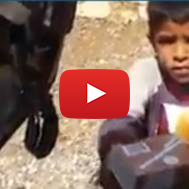 Palestinian child gets lunch from IDF soldier