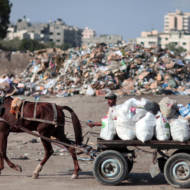 A Palestinian at a dump in Gaza City. (Wissam Nassar/Flash90)