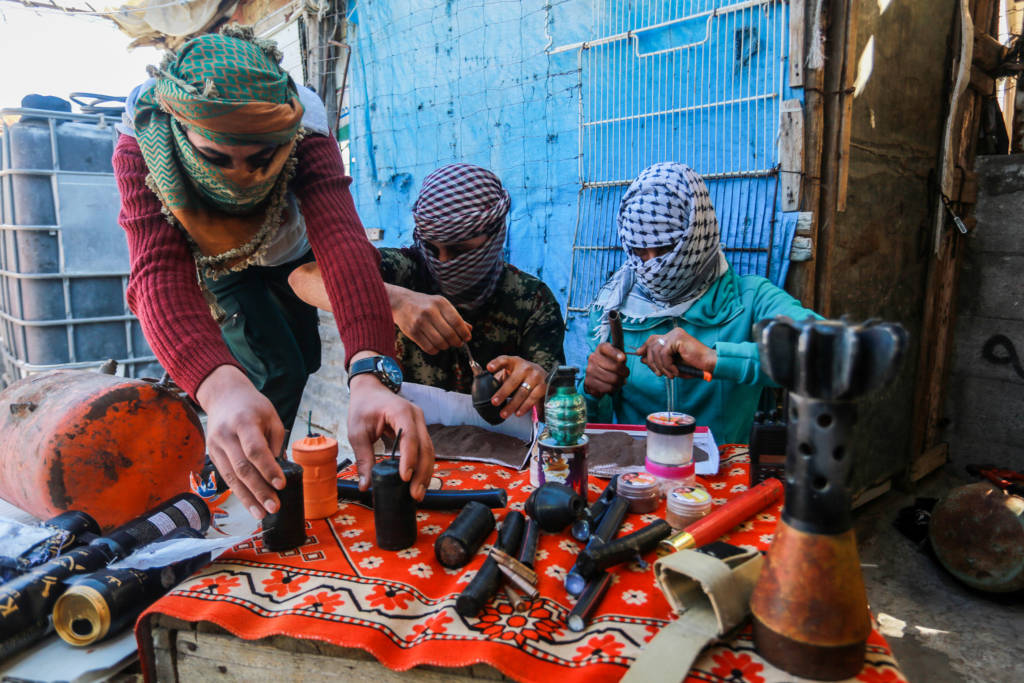 Palestinian prepare explosives with which to try to kill Israelis on the Gaza border. (Abed Rahim Khatib/Flash90)