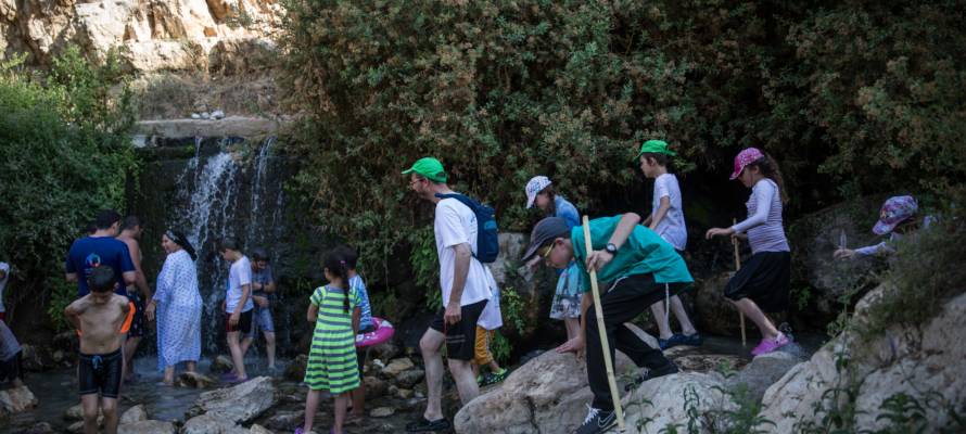 Hikers at Israel's Ein Meboa Spring. (Hadas Parush/Flash90)
