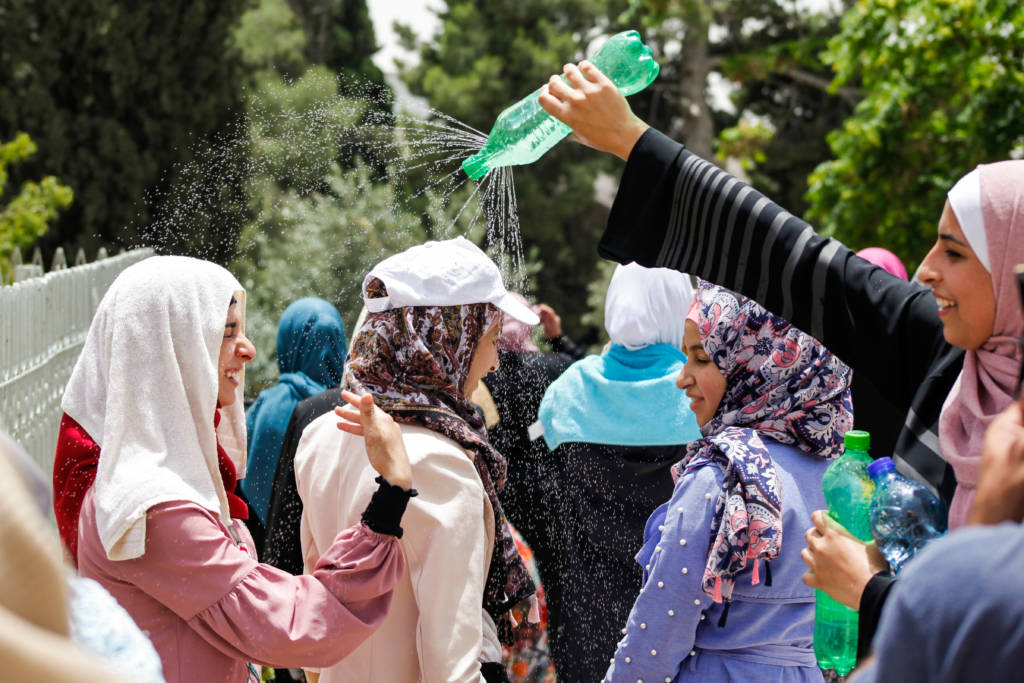 Muslim women cool off during Ramadan. (Sliman Khader/Flash90)