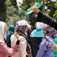 Muslim women cool off during Ramadan. (Sliman Khader/Flash90)