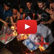 Palestinians in Gaza burn pictures