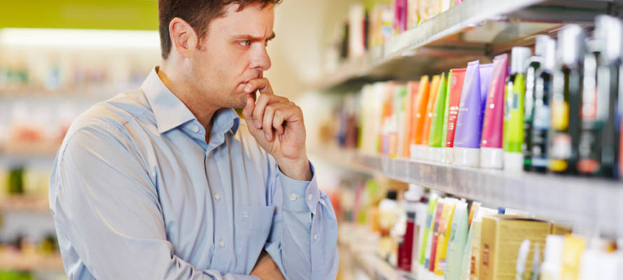 Pensive man at supermarket