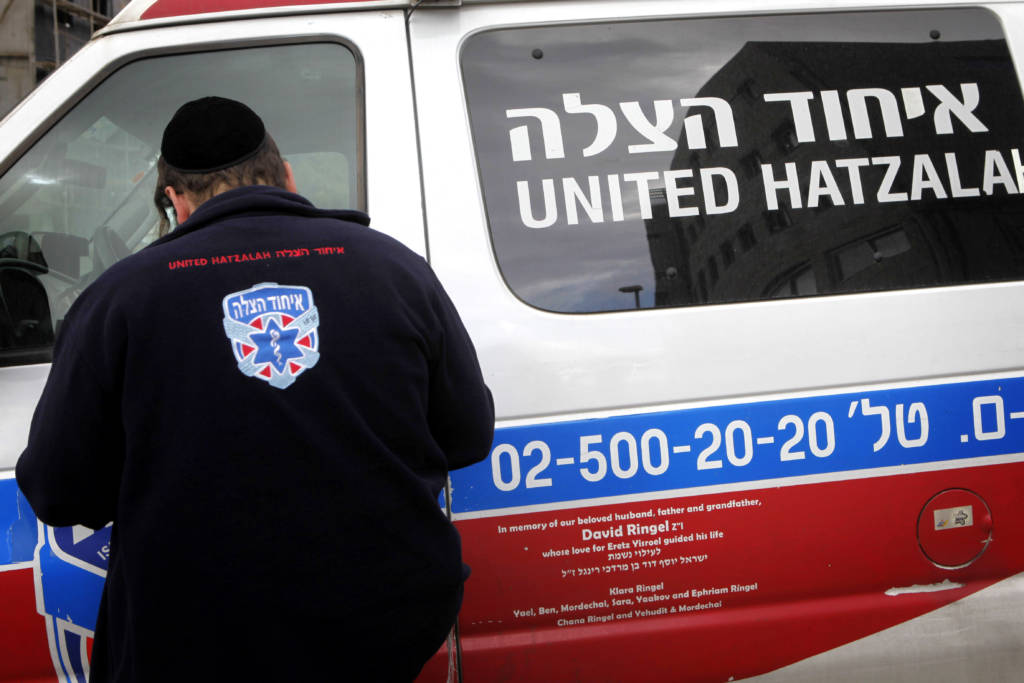 An Orthodox Jewish volunteer of the Emergency Medical Service organization, United Hatzalah, seen near an ambulance in Jerusalem.