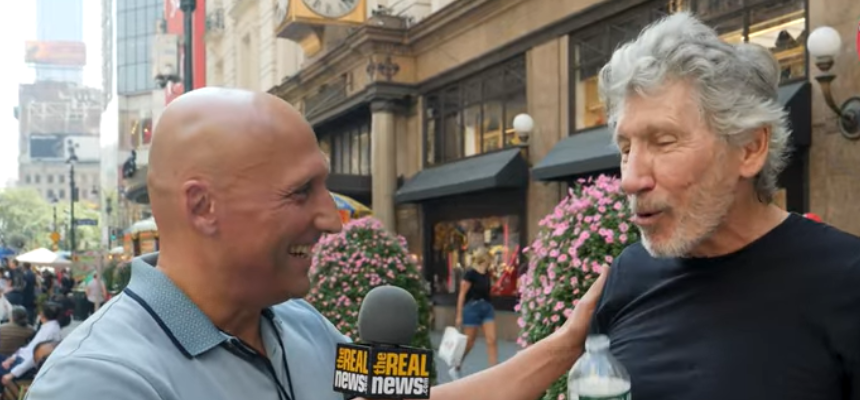 Roger Waters spits out water when asked about Iran's human rights abuses. (Screenshot)