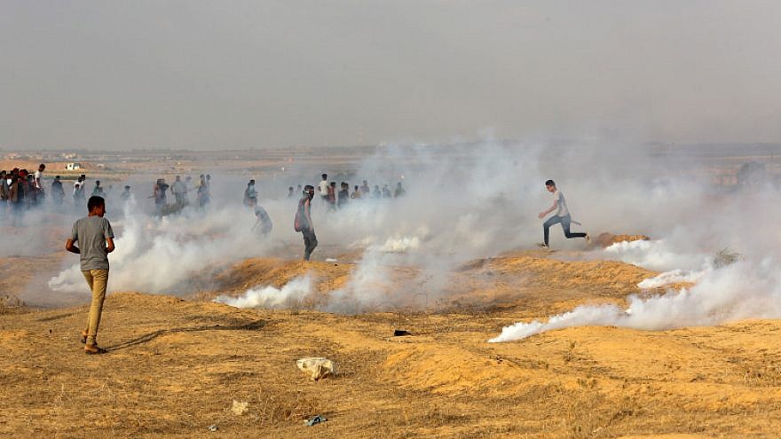 Palestinian protesters clash with Israeli forces near the Gaza-Israel border, east of Rafah in the southern Gaza Strip, Sept. 13, 2019.