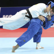 Luka Maisuradze of Georgia, top, competes against Saeid Mollaei of Iran during a men's -81 kilogram bronze medal match of the World Judo Championships in Tokyo, Wednesday, Aug. 28, 2019.