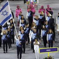 Neta Rivkin carries the flag for the Israeli delegation during the opening ceremony for the 2016 Summer Olympics in Rio de Janeiro, Brazil, Friday, Aug. 5, 2016