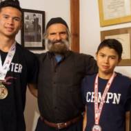 Brothers Kibedy, Ruach Hashem and Ahavat Hashem Gordon with their father, Azriel. (Courtesy)