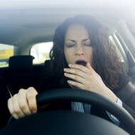 Woman falling asleep while driving (Shutterstock)