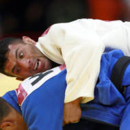 In this Thursday, Aug. 30, 2018 file photo, Saeid Mollaei of Iran, top, competes against Didar Khamza of Kazakhstan during their men's - 81kg final judo match at the18th Asian Games in Jakarta, Indonesia.