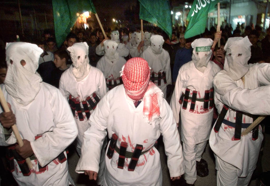 Palestinians in suicide bomber outfits in 2002