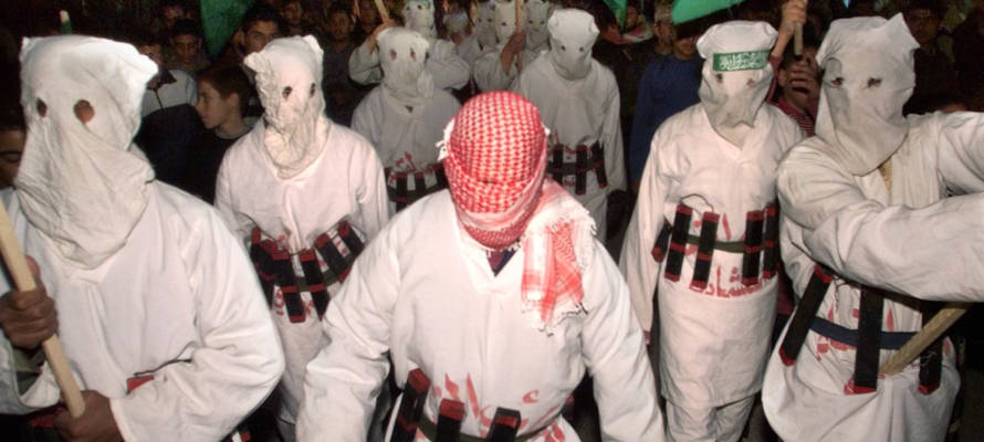 Palestinians in suicide bomber outfits in 2002