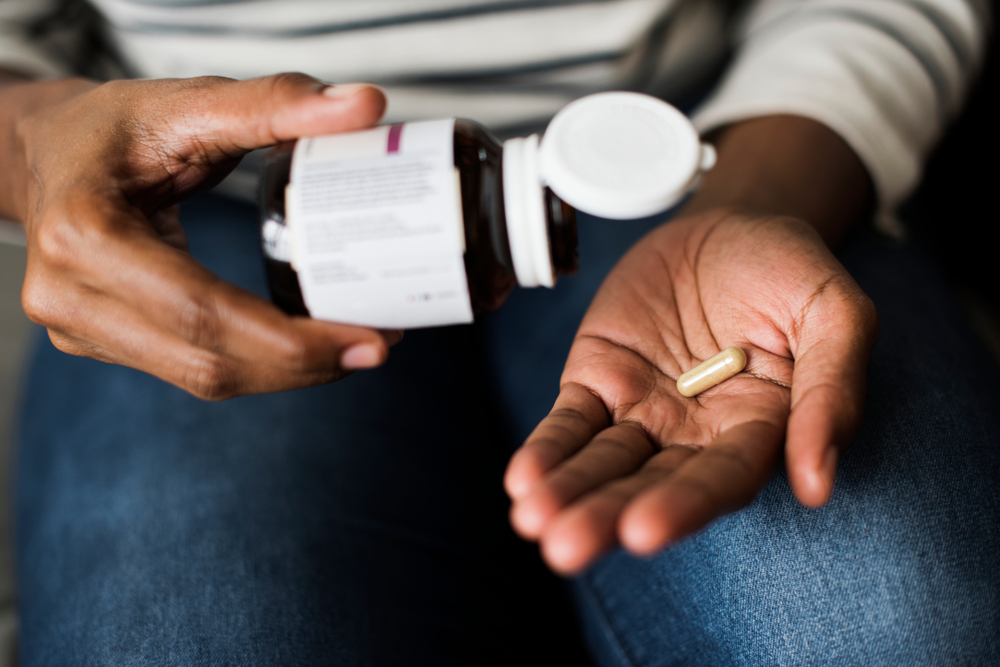 taking a capsule pill