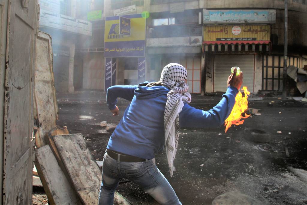 A Palestinian a Molotov cocktail