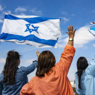 Israeli medical staff cheer an Israeli Air Force acrobatic team.