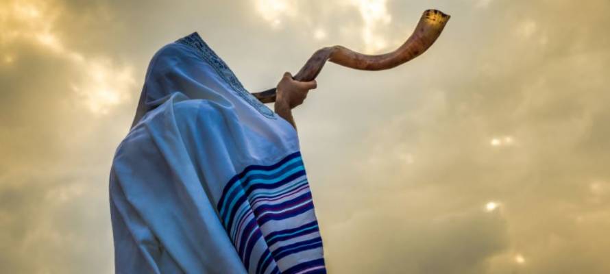 man blowing shofar