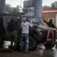 Palestinians throw rocks