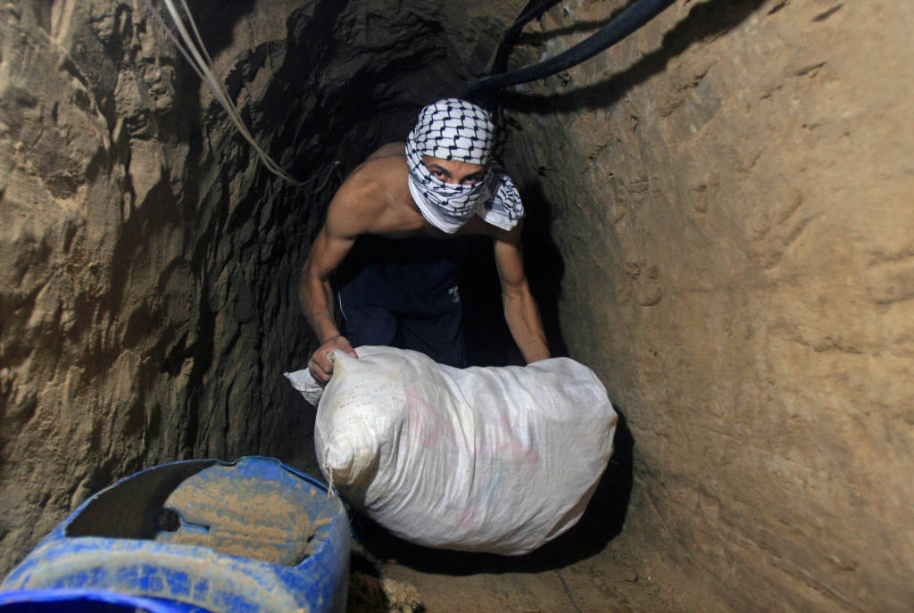 Palestinians smuggle goods and food through tunnels from Egypt