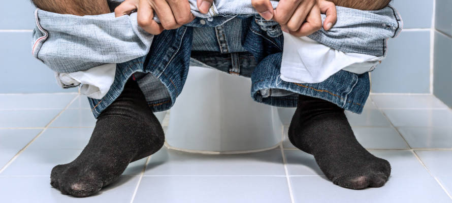 Man on toilet.