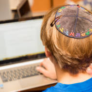 Jewish boy with computer