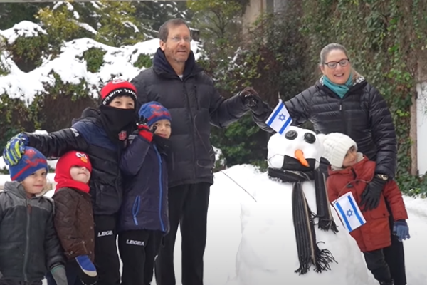 President Herzog and First Lady playing in the snow at the President's Residence in Jerusalem