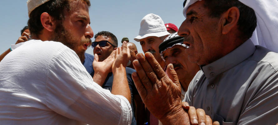 Palestinian argues with an Israeli