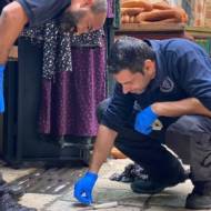 Israel Police officers investigate the scene of a terrorist attack in Jerusalem's Old City