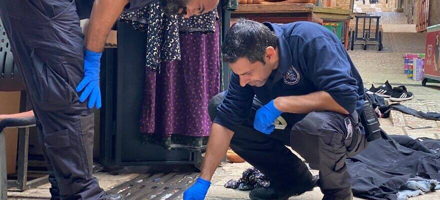 Israel Police officers investigate the scene of a terrorist attack in Jerusalem's Old City