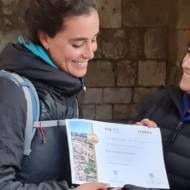 Spanish pilgrim Carlota Valenzuela is greeted by Israel’s director of religious tourism, Noga Sher-Greco