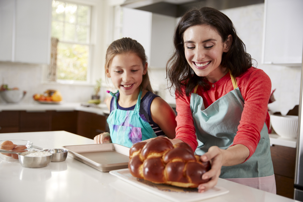 Jewish mother and daughter back challah