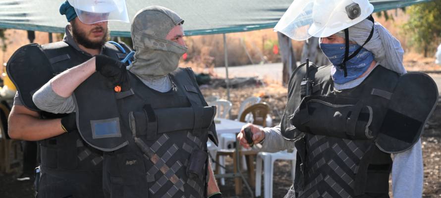 Workers of the Israel National Mine Action Authority (INMAA) searching for landmines