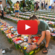 .Israeli soldiers and volunteers pack food for families in need