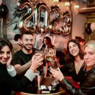 Israelis celebrating the new year on New Year's Eve, at a pub in Tel Aviv