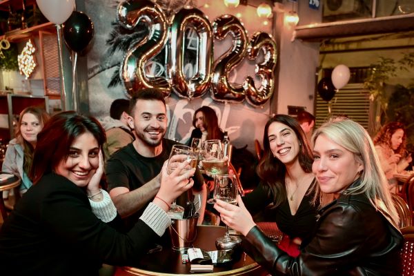Israelis celebrating the new year on New Year's Eve, at a pub in Tel Aviv