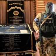 Ukrainian security forces inside the synagogue at the Anatevka