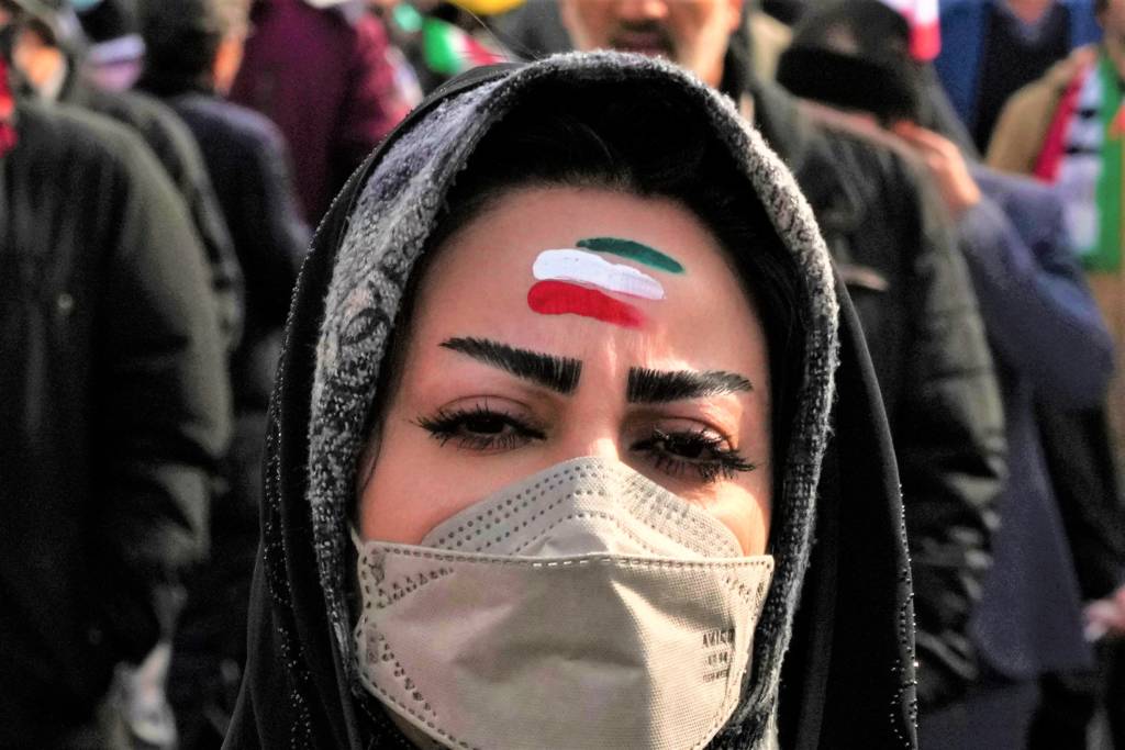 A woman celebrates Iran's 1979 Islamic Revolution in Tehran, Iran, Saturday, Feb. 11, 2023