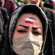 A woman celebrates Iran's 1979 Islamic Revolution in Tehran, Iran, Saturday, Feb. 11, 2023