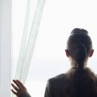 woman looking out the window