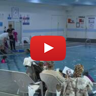 volunteers teach swimming
