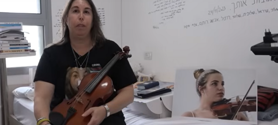 Merav Berger with a photo of her daughter, Agam