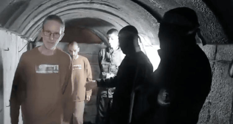 hostages Eli Sharabi, Ohad Ben Ami and Or Levy being led through a tunnel (Feb 2025,